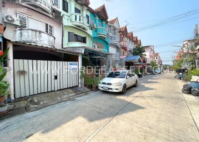 View of a residential neighborhood street with parked cars