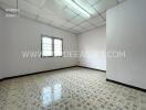 Empty bedroom with tiled floor and window