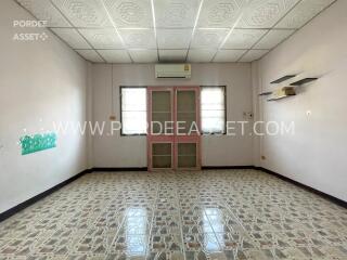 Empty living room with tiled flooring and air conditioning