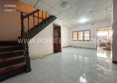 Spacious living room with staircase