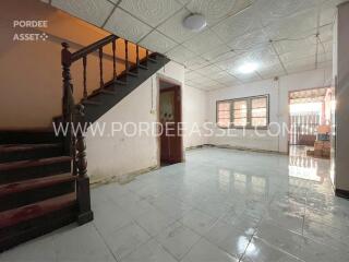 Spacious living room with staircase