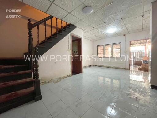 Spacious living room with staircase