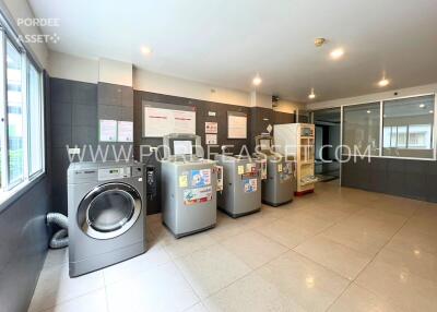 Spacious laundry room with multiple machines