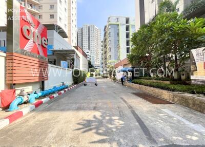 View of a building entrance with surrounding high-rise apartments