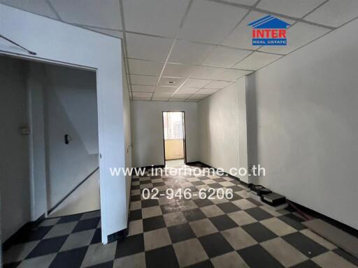 Unfurnished room with checkered flooring