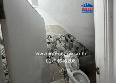 Small bathroom with geometric tile design