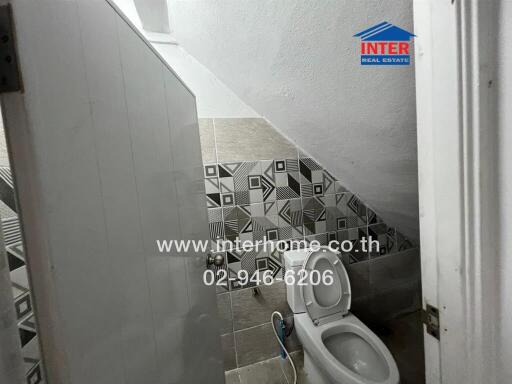 Small bathroom with geometric tile design