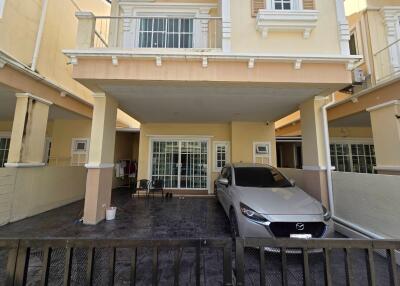 Front view of a house with garage and car parked