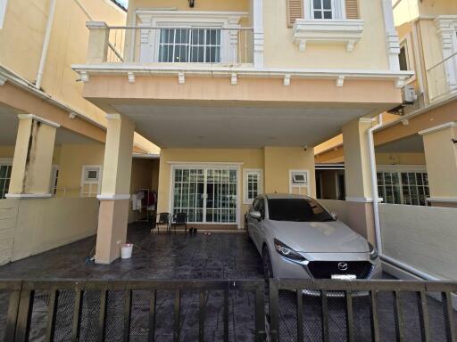 Front view of a house with garage and car parked