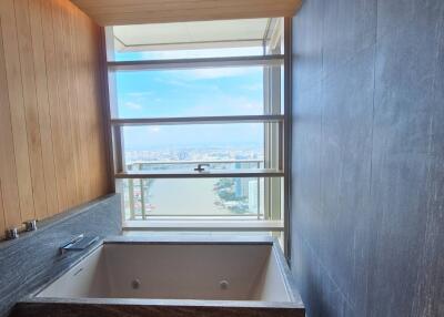 Modern bathroom with a large bathtub and a scenic view