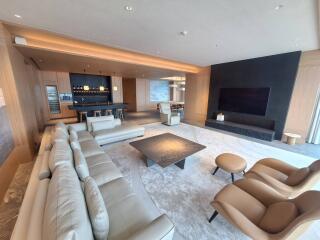 Modern living room with open kitchen and dining area