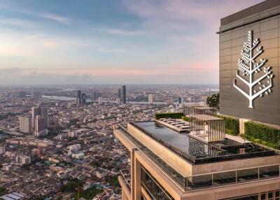 High-rise building with rooftop pool overlooking city skyline