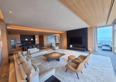 Modern spacious living room with wooden ceiling and ocean view