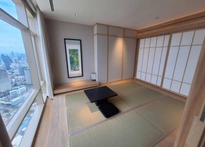 Modern Japanese-style living room with tatami mats and city view