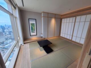 Modern Japanese-style living room with tatami mats and city view