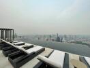 Rooftop view with lounge chairs and infinity pool