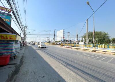 Street view with cars and sidewalk