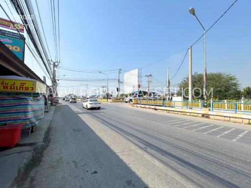 Street view with cars and sidewalk