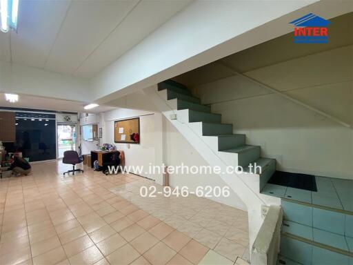 Interior view with stairs, tiles and workspace