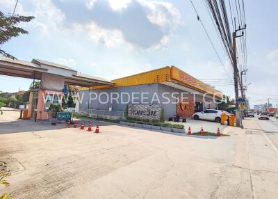 Exterior view of a commercial building with parking area