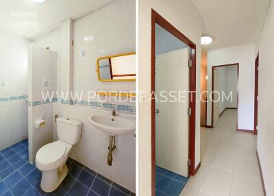 Bathroom with white fixtures and blue tile flooring