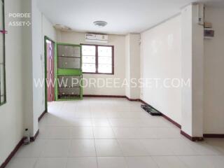 Spacious living room with large windows at Por Dee Asset