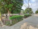 Tree-lined street near property