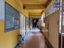 Hallway with yellow walls and tiled floor