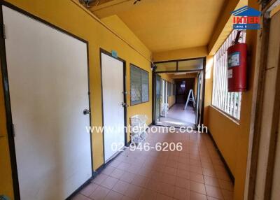 Hallway with multiple doors and windows