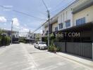 Modern townhouse with parked car and driveway