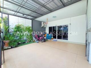 Spacious indoor garden area with plants and bicycles