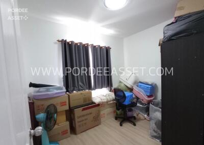 Unfurnished bedroom with boxes and storage items