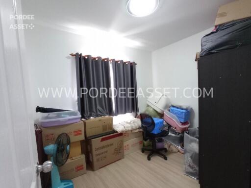 Unfurnished bedroom with boxes and storage items