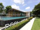 Outdoor pool and modern building with greenery