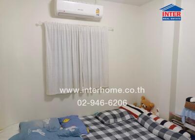 Cozy bedroom with air conditioning and comfortable bedding