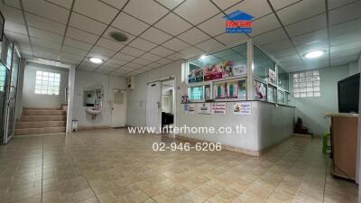 Interior of a building with tiled floors and reception area