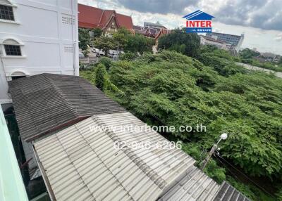 View from building overlooking trees and other buildings