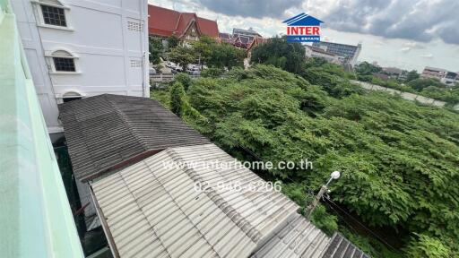 View from building overlooking trees and other buildings