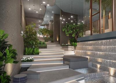 Modern building entrance with greenery and steps