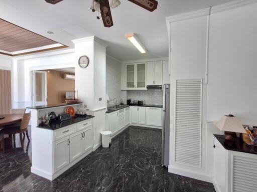 Modern kitchen with adjacent dining area