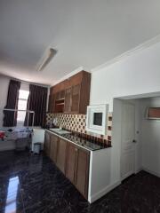 Modern kitchen with wooden cabinets and tiled backsplash