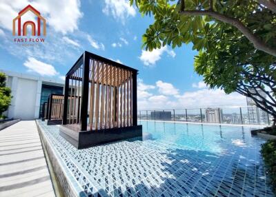 Rooftop pool with cabanas and city view