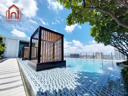 Rooftop pool with cabanas and city view