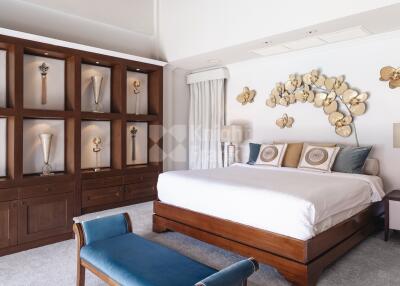 Stylish bedroom with decorative shelving and wall art