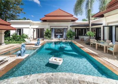 Luxurious backyard with swimming pool and seating area