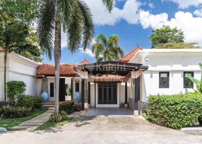 Exterior view of a house with a driveway and front yard