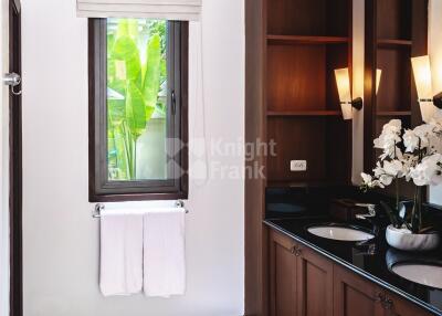 Modern bathroom with double sink and natural light