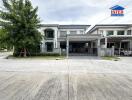 Modern residential building with two floors and a driveway