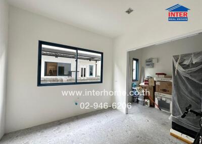 Unfurnished room with window and boxes