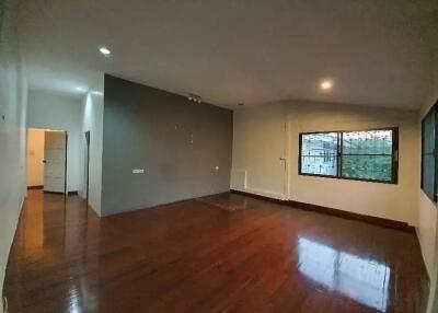 Spacious living room with wooden flooring